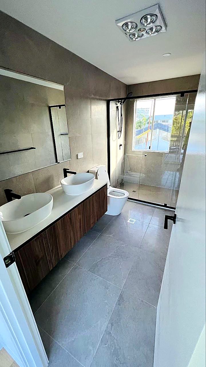 Double vanity bathroom with frameless shower screen